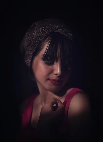 Intense Spotlight Portrait of Woman with Headwrap