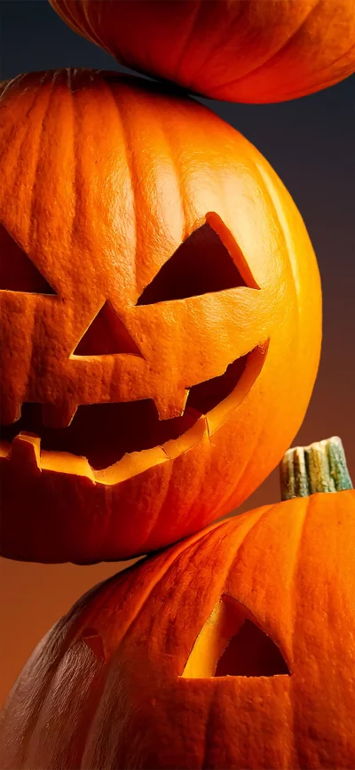 Spooky Stacked Jack-o'-Lanterns Ready for Halloween Night