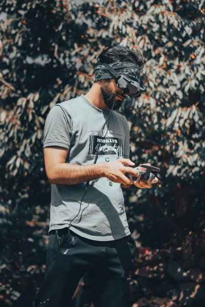 Man Wearing FPV Goggles Drone Controller