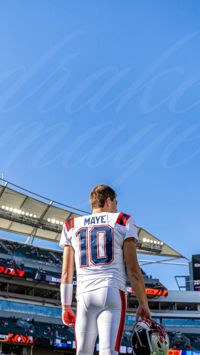 Football Player MAYE 10 on the Field Holding Helmet