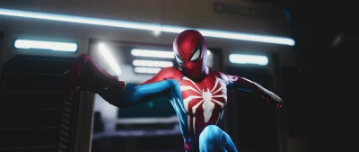 Dynamic Marvel's Spider-Man in Iconic Red and Blue Suit Against Futuristic Blue-Lit Interior image