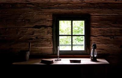 Rustic Log Cabin Interior with Bright Window and Vintage Objects image