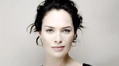 Compelling Portrait of a Woman with Piercing Grey-Green Eyes and Dark Hair image