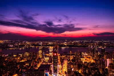 Vibrant Metropolitan Skyline Night View with Purple Pink Sunset Sky image