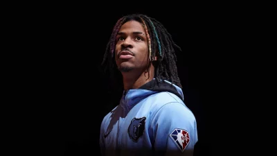 Focused Ja Morant in Memphis Grizzlies Jersey with Distinctive Colorful Dreadlocks image
