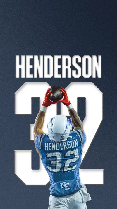 Football player Henderson catches the ball in mid-air image