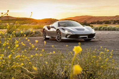 Stunning Grey Ferrari Sports Car Parked at Golden Sunset Cinematic Wallpaper Style image