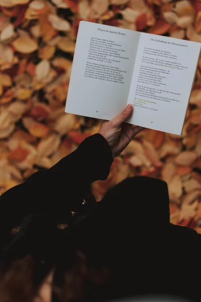 a hand holding a book