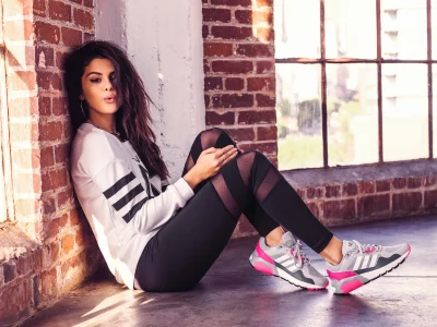 Selena Gomez Posing in Sporty White Sweatshirt and Sheer Leggings by Loft Window image