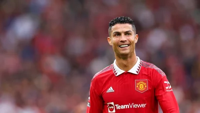 Legendary Cristiano Ronaldo Grinning in Manchester United Soccer Uniform image