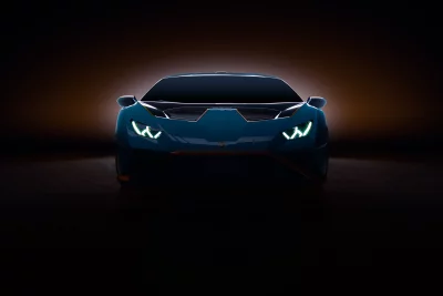 Sleek Dark Blue Sports Car with Glowing LED Headlights at Night image