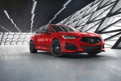 Vibrant Red Acura TLX Type S Performance Sedan in Modern Showroom image