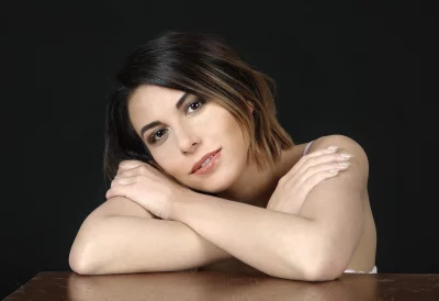 Thoughtful Young Woman with Short Hair and Crossed Arms Portrait image