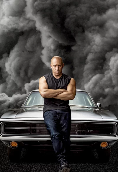 Dominic Toretto with Classic Muscle Car Amidst Dramatic Smoke, Fast and Furious Film Still image