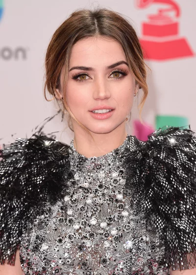Beautiful actress with captivating green eyes in a dazzling sequined gown at an awards show image
