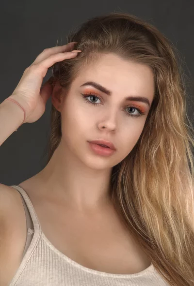 Stunning Young Woman Portrait: Blonde Hair, Green Eyes, Natural Makeup image