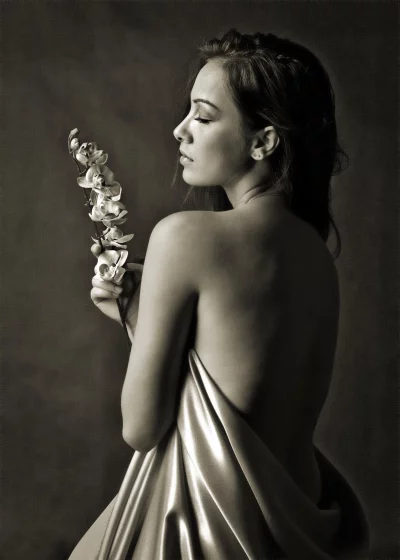 Monochrome Portrait of Woman with Closed Eyes and Orchids in Gentle Drape image