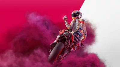 Dynamic MotoGP Racer Leaning into Turn with Vibrant Pink Smoke Effect image