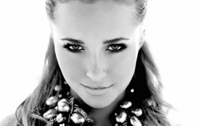 Monochrome close-up of a stunning woman with glamorous eye makeup and sparkling necklace image