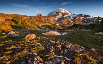 Majestic Mount Rainier Reflection in Serene Alpine Lake at Golden Hour image