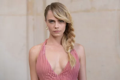Cara Delevingne's Striking Portrait in Elegant Pink Pleated Gown image
