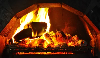 Cozy Fireplace with Burning Logs and Glowing Embers image