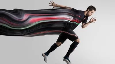 Dynamic Cristiano Ronaldo Sprinting with Motion Blur in Black Soccer Kit image