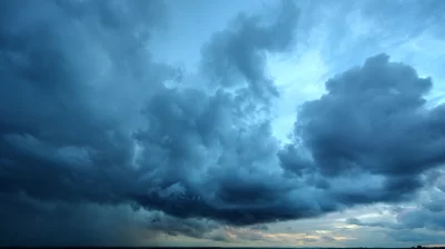 Dramatic Dark Storm Clouds Gathering Over the Horizon at Dusk