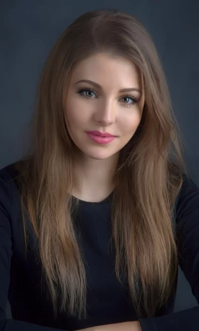 Beautiful Young Woman with Long Brown Hair and Pink Lipstick Looking at Camera image