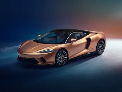 Luxurious Golden McLaren GT Sports Car with Sleek Design in Studio image