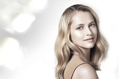 Radiant Blonde Woman with Striking Blue Eyes and Soft Wavy Hair Portrait image