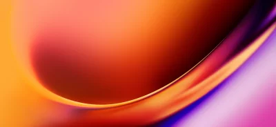 Reflective curved surface showcasing a vibrant spectrum of orange, red, and purple light image