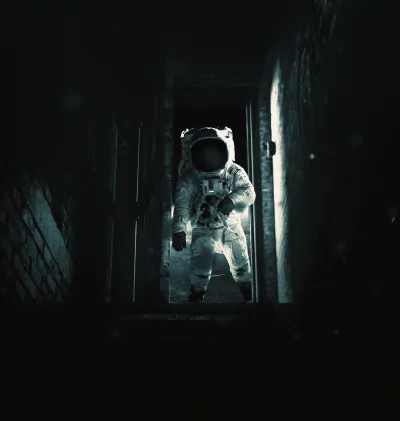 Astronaut in Spacesuit Emerges from Dark Eerie Corridor for Sci-Fi Exploration image