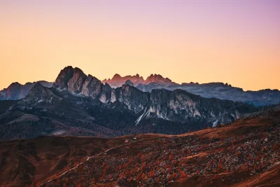 Dramatic Mountain Range at Golden Sunset with Autumn Foliage Cinematic Wallpaper image