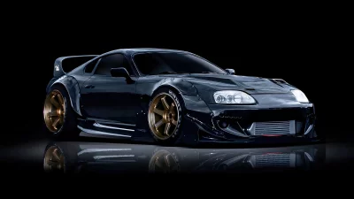 Aggressive Widebody Toyota Supra Performance Car with Gold Rims on Dark Studio Background image