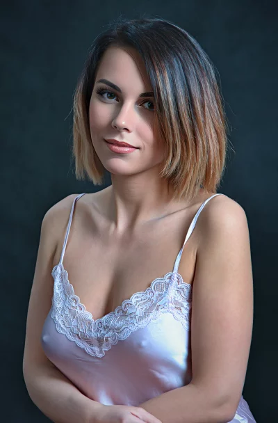 Captivating Young Woman in Pink Lace Camisole Portrait image