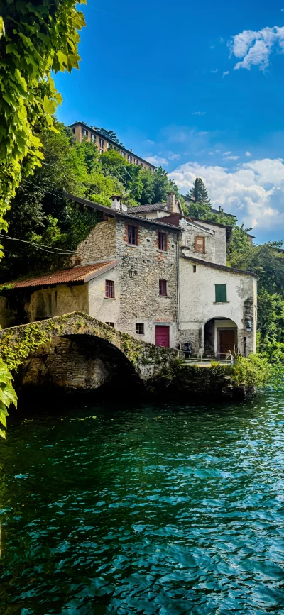 Charming Stone Bridge and Waterfront House in Lush Green Setting