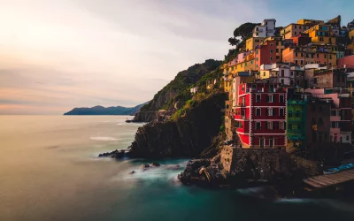 Vibrant Italian Coastal Village on Cliffside Overlooking Serene Mediterranean Sea image