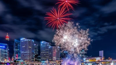 Spectacular Fireworks Bursting Over Vibrant Sydney City Skyline at Night image