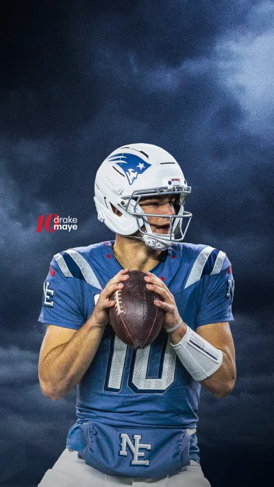 Drake Maye New England Patriots Quarterback Holding Football Ready for Action image
