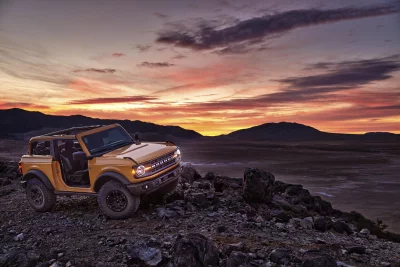 Ford Bronco Off-Road Adventure at Sunset with Dynamic Sky Cinematic Wallpaper image