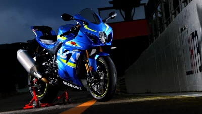 Sleek Blue Suzuki GSX R Sportbike with Neon Yellow Accents at Night image