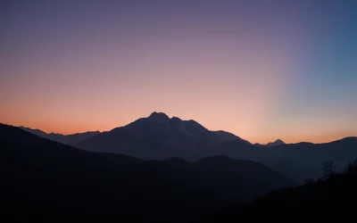 Dramatic Twilight Mountain Landscape with Vibrant Sky Gradient and Silhouettes image
