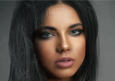 Captivating Close-up Portrait of a Young Woman with Dark Hair and Mesmerizing Eyes image