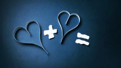 Symbolic Love Equation with Two Paper Hearts and Plus Sign on Dark Blue Background image