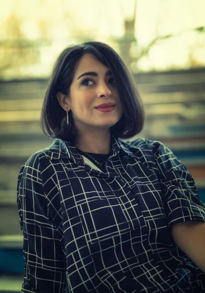Young Woman with Dark Bob Hair in Plaid Shirt