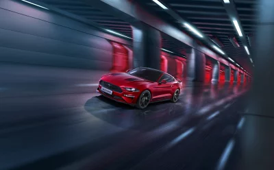 Sleek Red Ford Mustang GT Sports Car Racing in Futuristic Neon Tunnel image