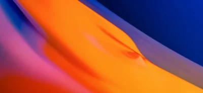 Smooth Dynamic Abstract Blend of Orange Blue and Pink Hues Gradient Wallpaper image