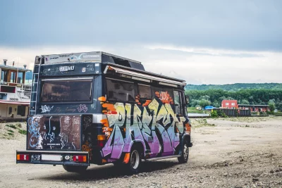 a photograph of a van covered in graffiti