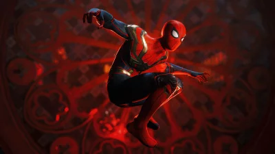 Dynamic Spider-Man in Iconic Suit Poised Against Glowing Red Gothic Background image